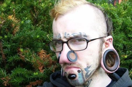 Ear-Gauges-and-Face-Tattoos.jpg