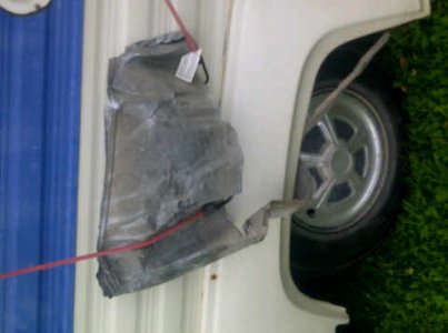 This was hanging off the trailer after the tire blew(1).jpg